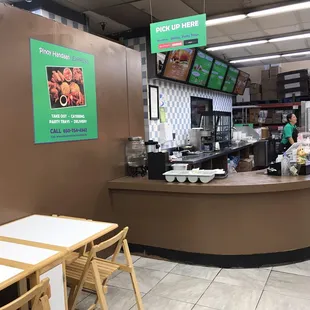 Front counter displays area for food pick up by UberEats, Doordash and Grubhub!