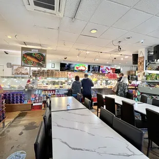 Another dining area near the food display cases.