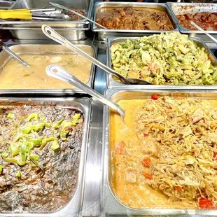 Trays of Filipino food dishes.
