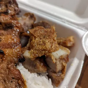 meat and rice in a styrofoam container