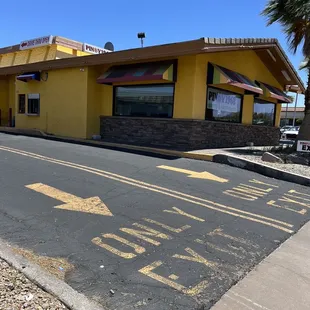 a restaurant with a yellow exterior
