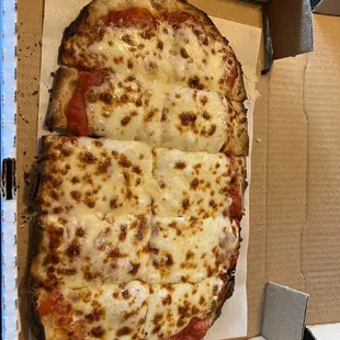 a cheese pizza in a box