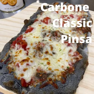 a homemade pizza on a cutting board