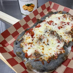 a pizza with cheese and meat