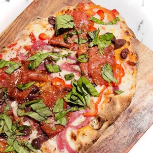 a pizza on a cutting board