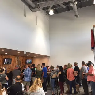 Long line of people waiting opening night.