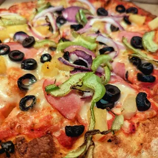 Close up of Hawaiian Pizza with extra ingredients