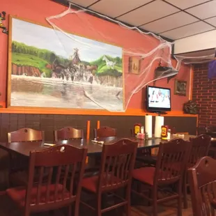 a dining area with tables and chairs