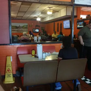 Inside as you walk in.