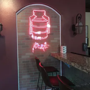 a neon sign of a ketchup