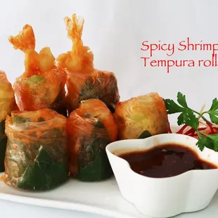 a plate of shrimp tempura rolls
