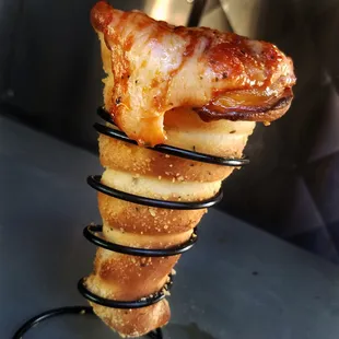 a hot dog on a stick