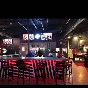 a sports bar with neon lights