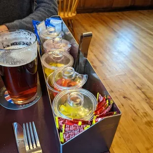 Onion, pepper, and condiment board for the table