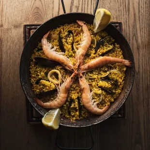 Paella de Mariscos. What better place than Pintxo Pincho to eat the delicious paella. Traditional seafood Paella made with saffron rice.