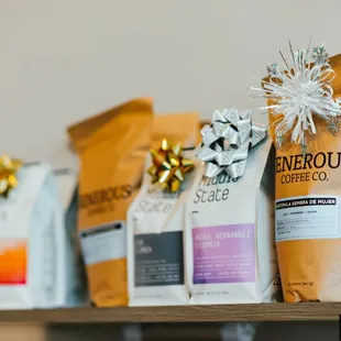 a variety of coffee bags on a shelf