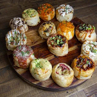 a variety of appetizers on a wooden plate