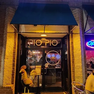 people sitting outside of a restaurant