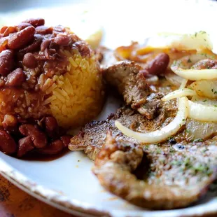 Grilled steak and arepa with an extra side of rice and beans