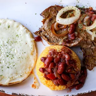 Grilled steak with arepa with an extra side of rice and beans