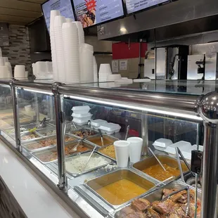 a woman standing in front of a buffet