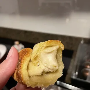 a person holding a pastry