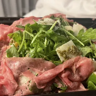 Beef carpaccio with extra arugula