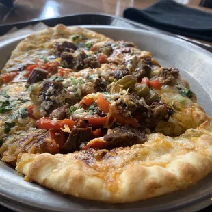 a slice of pizza on a plate