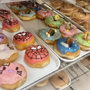 a variety of donuts in a display case