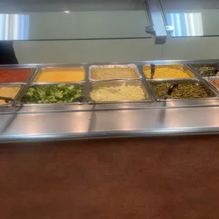 a buffet with a variety of food items