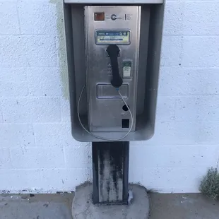 Telephone booth outside. Old school.