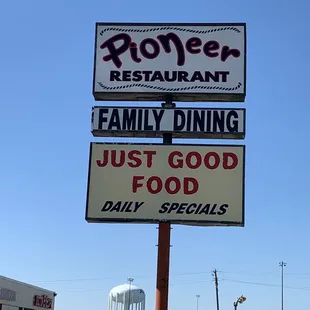 a sign for a family dining just good food