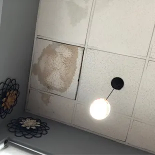 Many ceiling tiles had water damage.