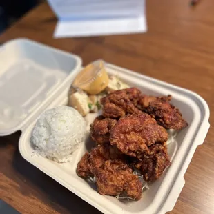 chicken and rice in a styrofoam container