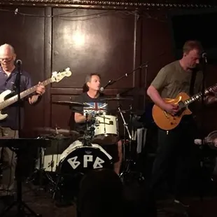 a group of men playing guitars