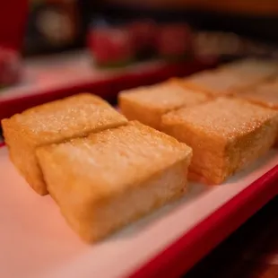 four pieces of bread on a tray