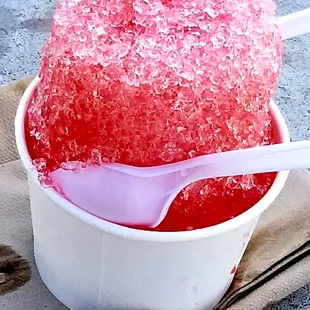 a bowl of ice cream with a spoon sticking out of it
