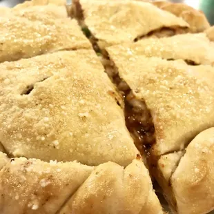 a pie cut in half on a plate