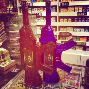 a gun and a bottle of liquor