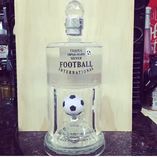 a soccer ball in a bottle
