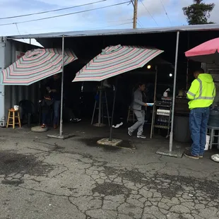 Located in a parking lot in a covered area