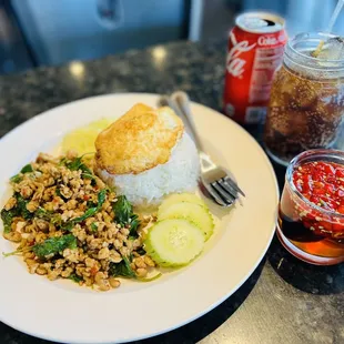 Holy Basil Chopped Chicken with Jasmine Rice and Fried Egg on top. chili Fish Sauce on the side!!!