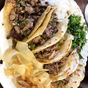 a plate of tacos and chips