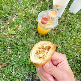 a person holding a piece of bread