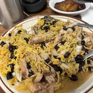 Yellow rice, black beans, and roasted pork with onion and Crystal hot sauce.  Mmmmmmm good.