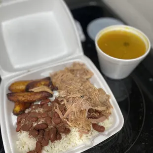 Roast Pork with rice and red beans. Added side of sweet plantains. Medium Spanish Chicken Soup.