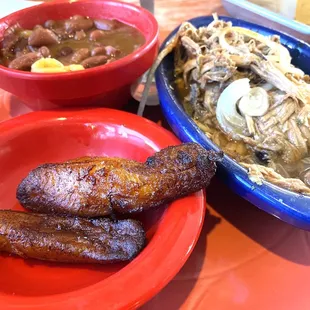 Pork pernil, red beans, and maduros.