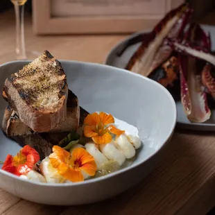 a plate of food and a glass of wine