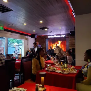 people sitting at tables in a restaurant