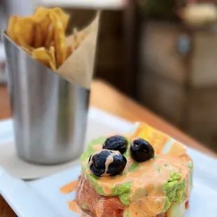 Ahi Tuna Tartare w/ nikkei sauce, lime, avocado, andean chips, tiradito sauce | $25